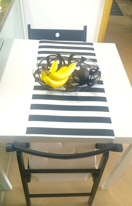Kitchen table, which can seat 4. Chairs can be taken onto balcony.