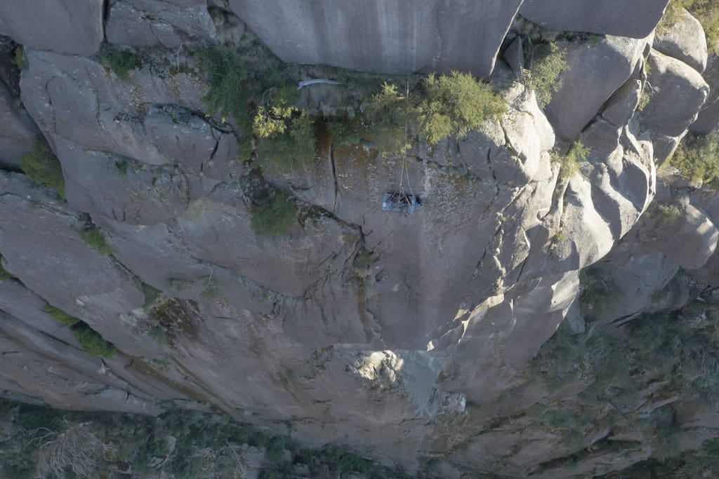 Birds-eye view showing vertical drop below the portaledge.