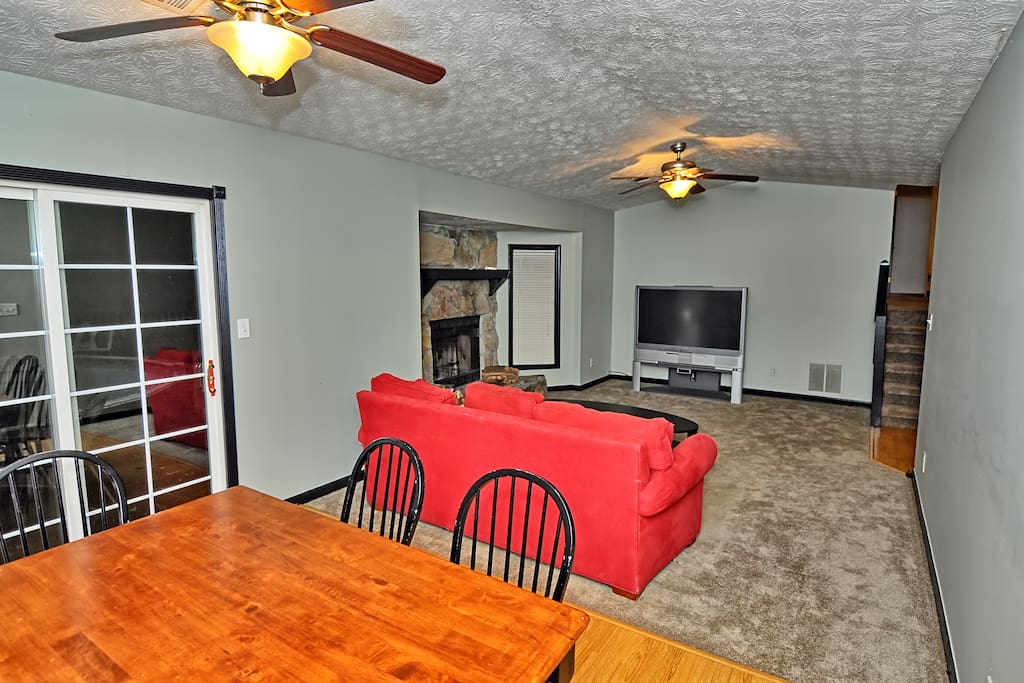 Living room area with TV and Sofa; dinning area