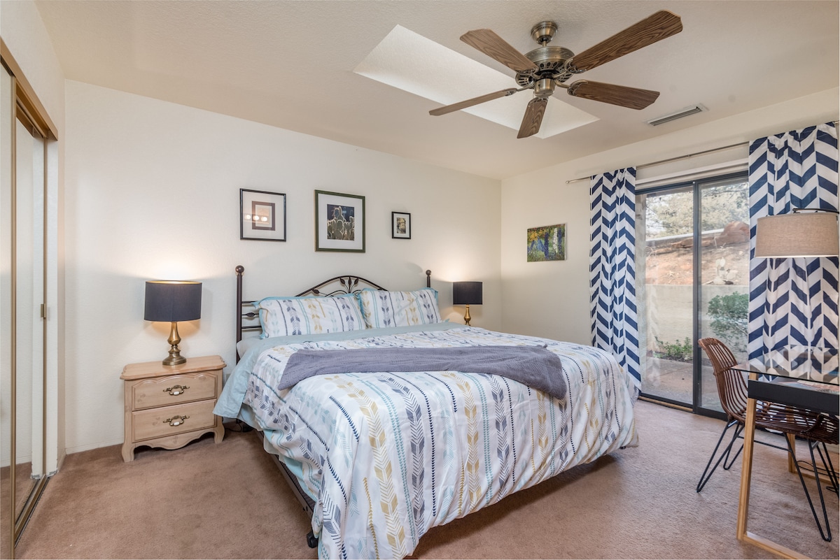 The Canyon Suite -- king bed, working/writing desk, an outdoor patio, ensuite bathroom.