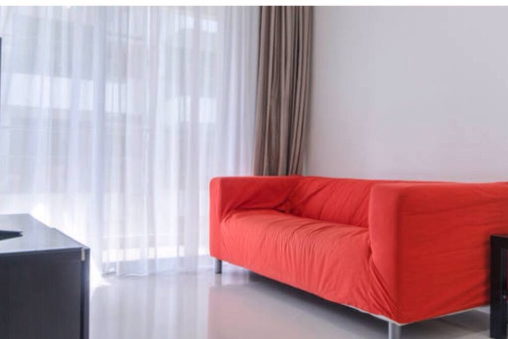 Cosy living area with ample natural light during day time