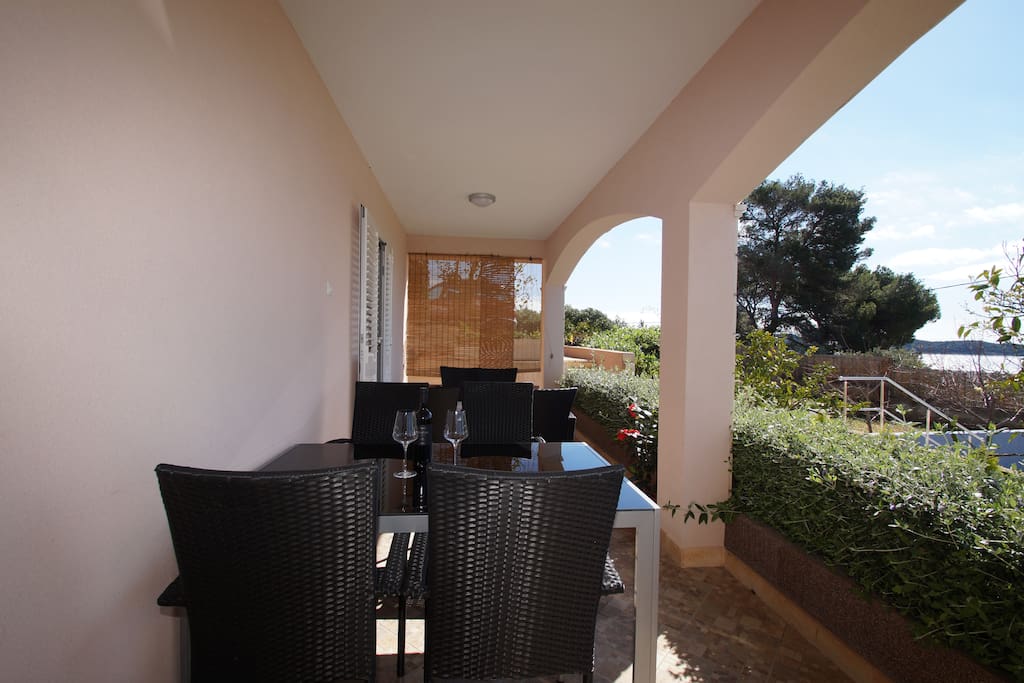 Balcony with dining table and garden furniture