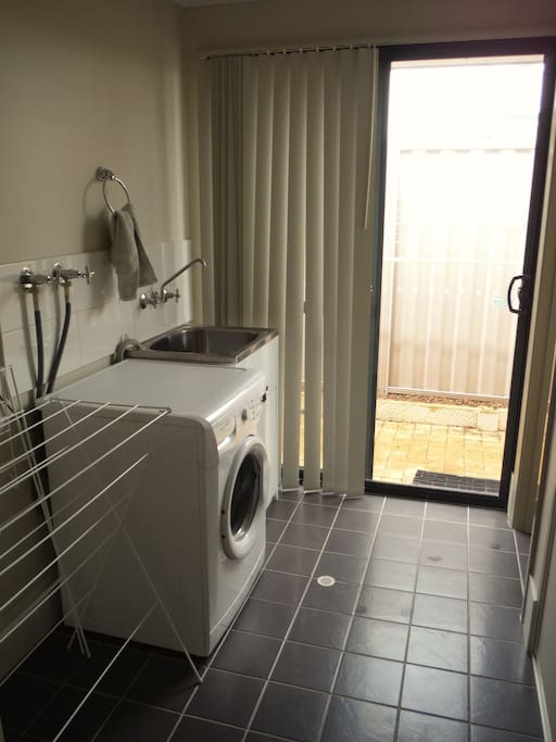 laundry with washing machine and outside line