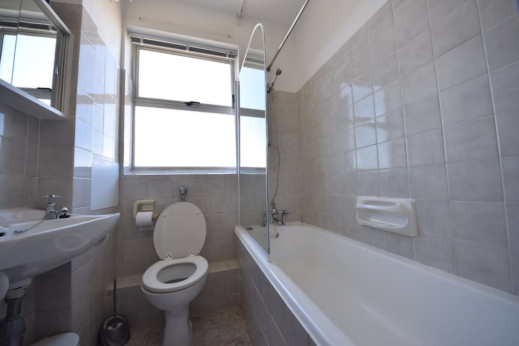 Bathroom with shower over bath