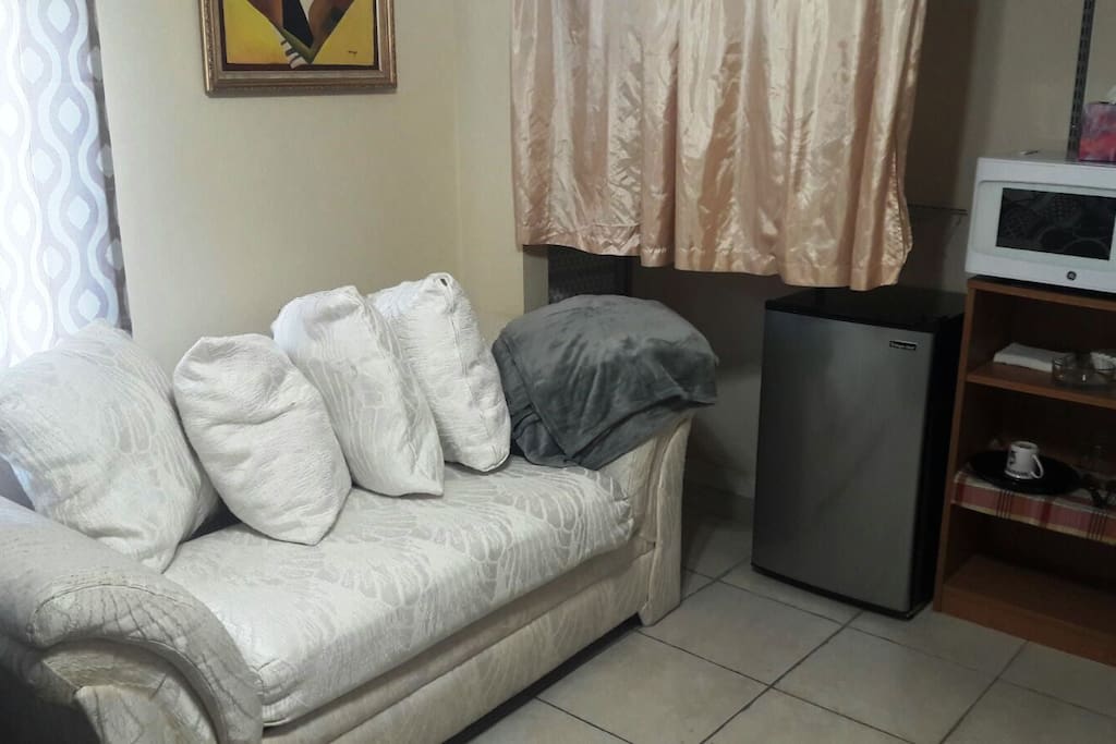 There is a closet with drawers iron and iron board for you to be prepared for every occasion. Feature curtains and privacy blinds. This room has a coffee maker, microwave and mini fridge for you to use and have a more comfortable stay.
