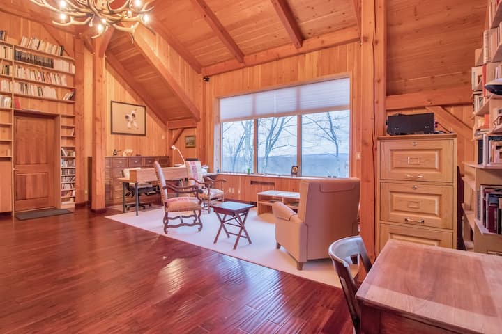 This upstairs room has been converted to a bedroom with a queen bed.