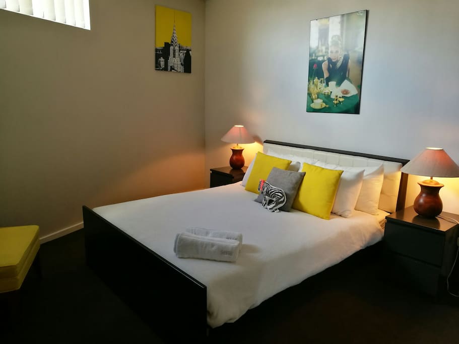 The Master Room features a super comfy Queen bed, private ensuite bathroom, built-in wardrobe and floor to ceiling mirrors.