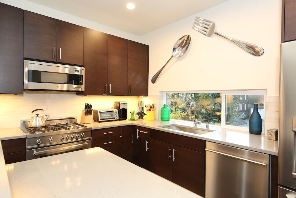 full stainless kitchen with gas stove