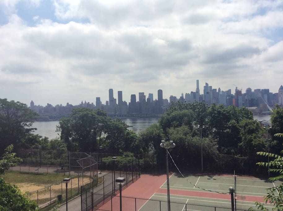 View of tennis courts and Hudson River across the street