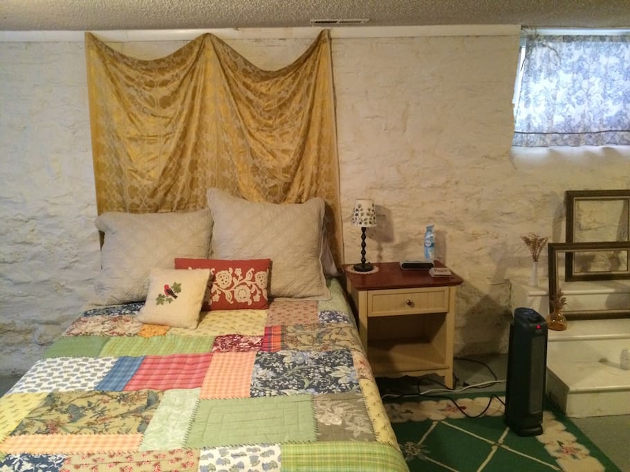 The room includes a full-size bed