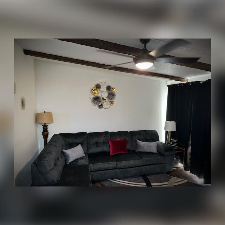 Linens are provided in a basket next to sofa. Extra pillows are in closet. 