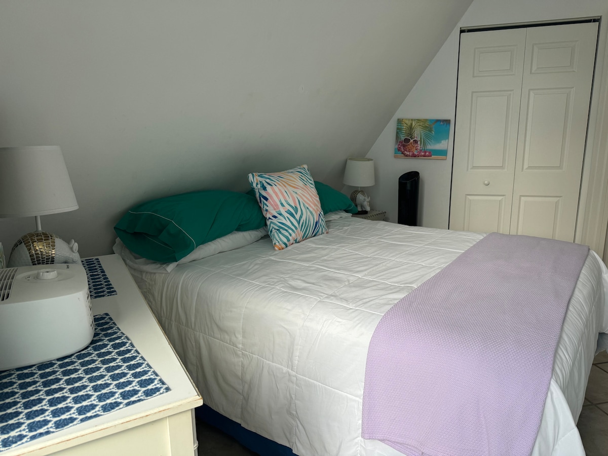 downstairs bedroom with queen bed