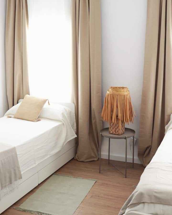 The superior apartment has a room with three single beds and a nest bed, which comes from under one of the beds.