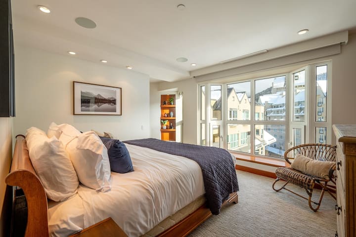 601 Master Bedroom with king bed, ensuite bathroom with walk-in shower, television and views of the upper village