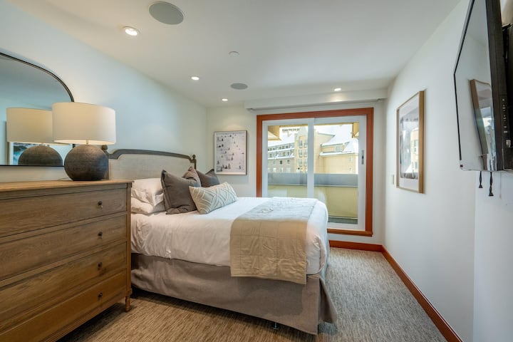 501 Queen Bedroom with television, juliette balcony and separate shared bathroom with walk-in shower