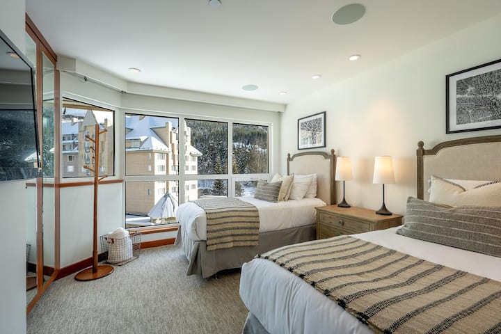 501 Twin Bedroom with television, separate shared bathroom with walk-in shower