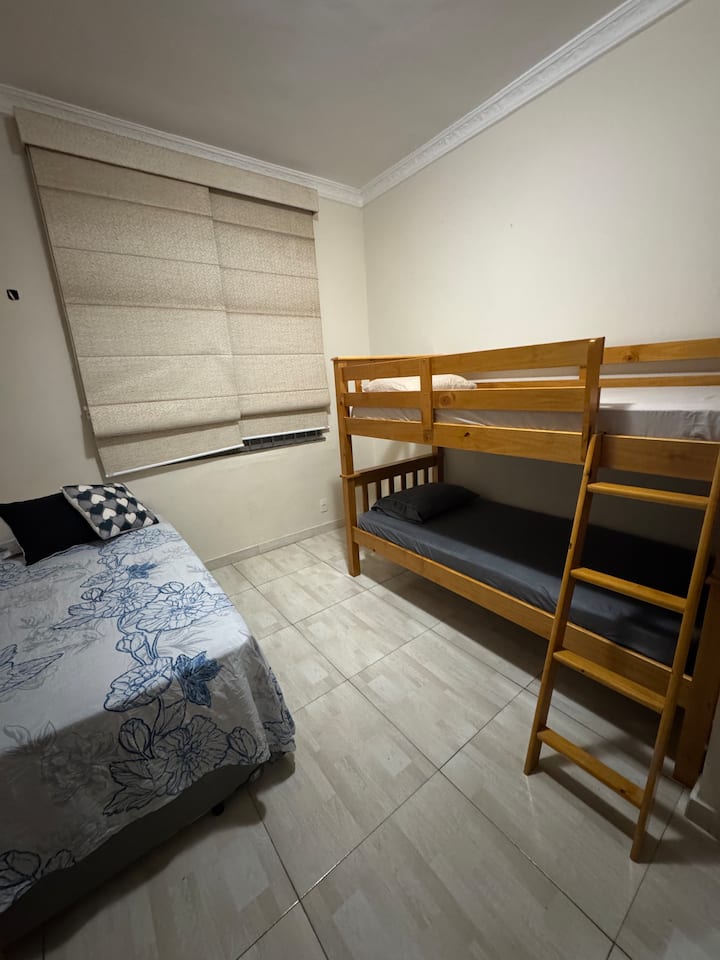 The space has 1 box bed with an auxiliary bed, 1 bunk bed and air conditioner.