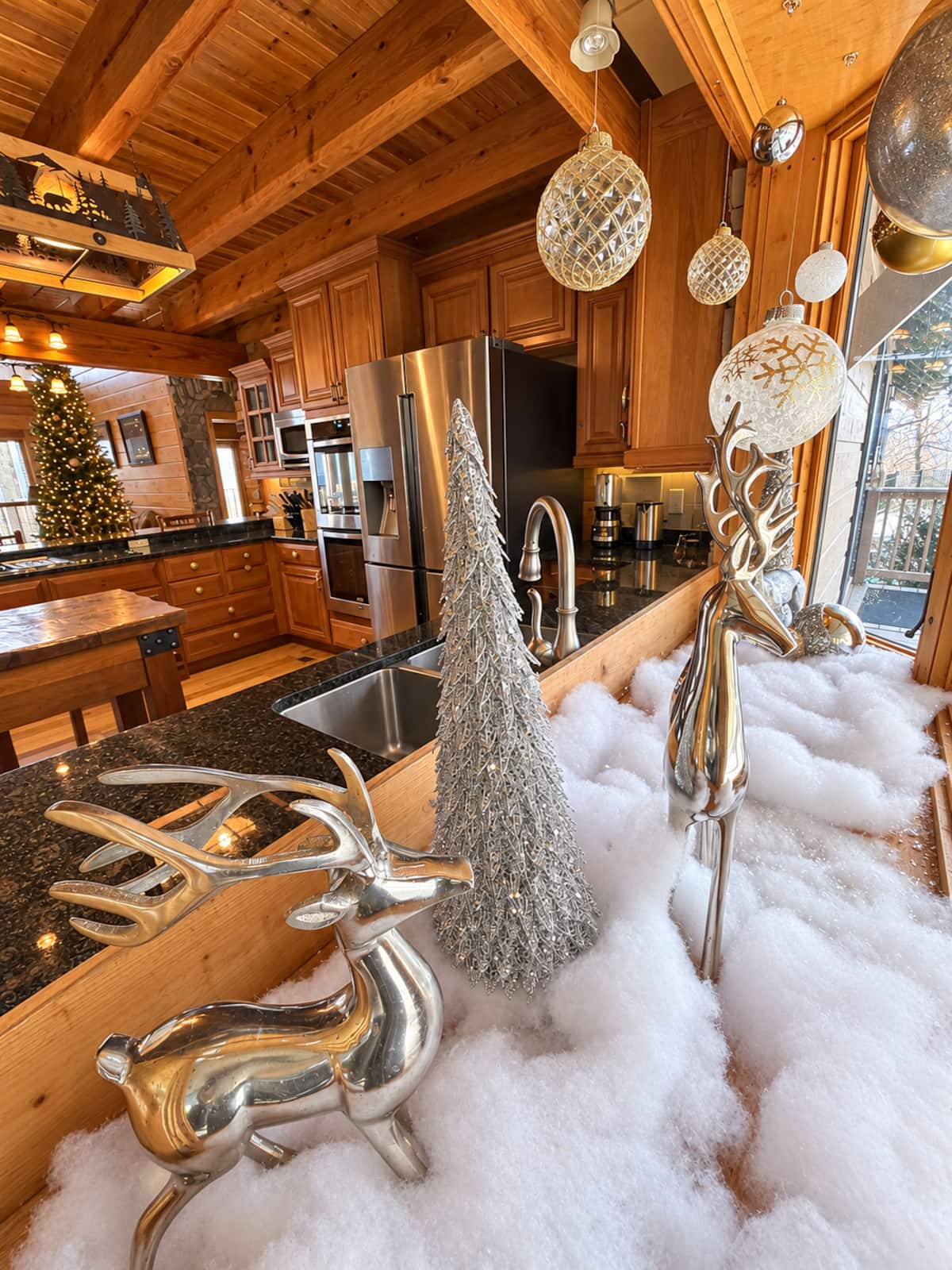 Silver reindeer and festive Christmas decorations in Majestica’s kitchen.