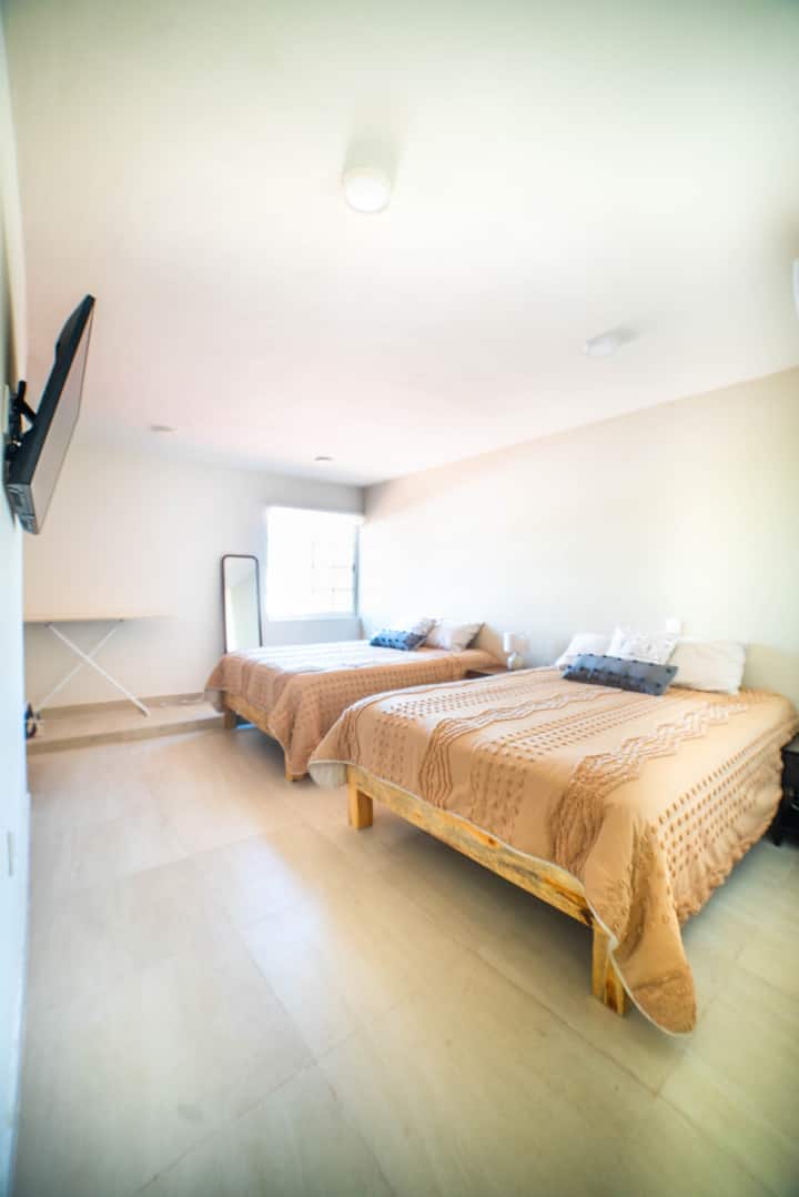 Master bedroom with two queen size beds