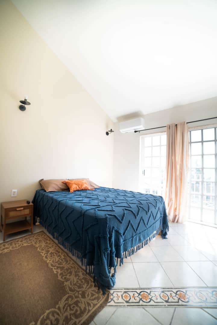 Secondary bedroom with a queen bed