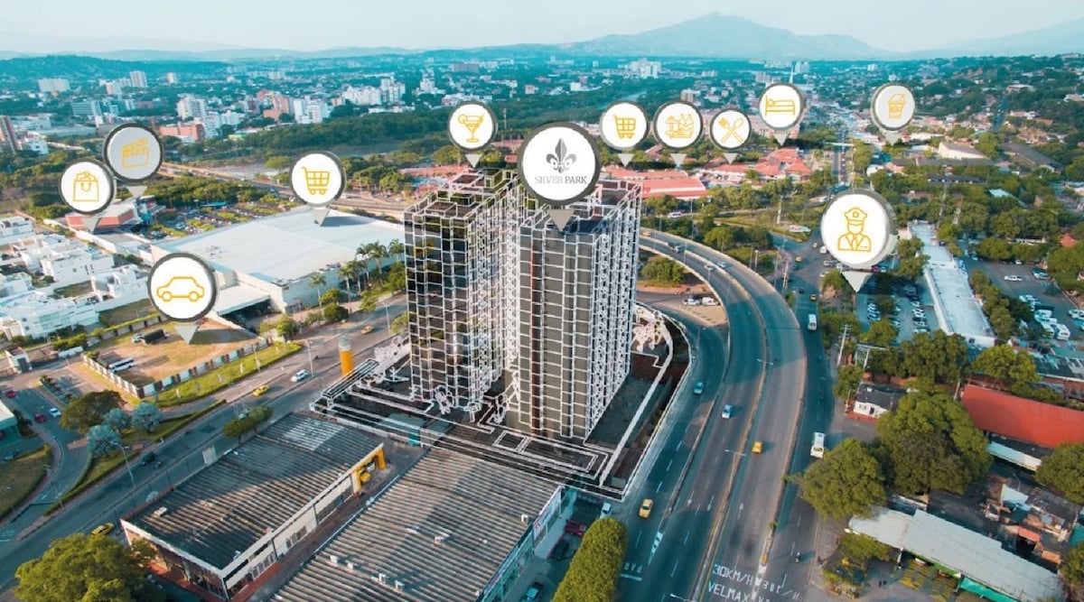 An aerial view of a modern apartment building is presented, nestled within a bustling urban area. Surrounding amenities, such as shopping centers, restaurants, and other services, are marked by icons, highlighting the vibrant neighborhood. The expansive cityscape is visible in the background.