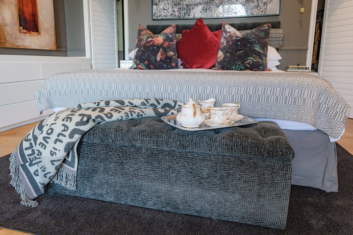 King Bed, walk through closer, 2 bathrooms ensuite with secluded patio and interleading door to the gym