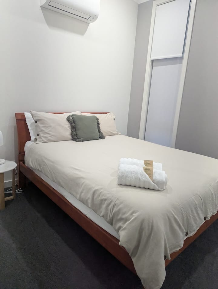 Our bedrooms include:
* Reverse cycle air conditioning for personalized climate control and year-round comfort.
* A spacious wardrobe with ample room to hang clothing and store your belongings.