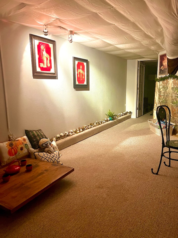 Master bedroom with private work space and tea nook. ￼ If you enjoy yoga, this is a perfect space. ￼Almost the size of the entire upstairs, the master bedroom is most of the lower level.