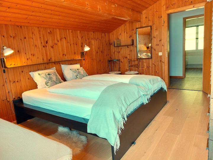 Under the roof, on top: 1 bedroom with a king size bed. Balcony, bathroom with shower. On request: 1 or 2 extra beds with high quality mattress. (room gets tight with 2 extra beds)