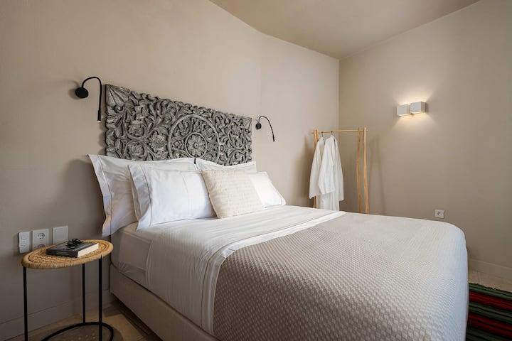 Cozy Queen Bedroom with Carved wooden  Headboard
