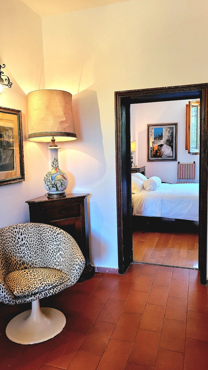 The primary bedroom is located on the 1st floor, the main level of the house. The bedroom features a sublime marble bathroom with walk-in shower, and a sitting room with sofa bed, fireplace and television. Perfect for those who can't climb stairs.