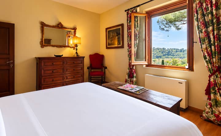 The Goldie Suite, named after Actress Goldie Hawn who once rented the villa for an extended period while writing her novel. This bedroom features a king size bed & an armoire that dates back to the late 1700s. This room has wonderful courtyard views.
