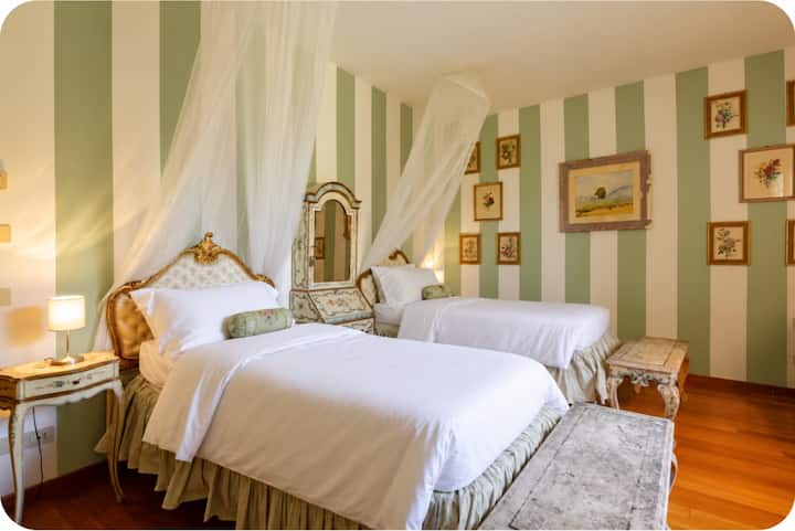 The Venetian Suite- with antique hand painted furniture this room is whimsical, witty and absolutely beautiful.  Featuring two single beds, this room is a guest favorite and is loved on Instagram.