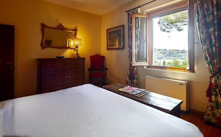 The Goldie Suite, named after Actress Goldie Hawn who once rented the villa for an extended period while writing her novel. This bedroom features a king size bed & an armoire that dates back to the late 1700s. This room has wonderful courtyard views.