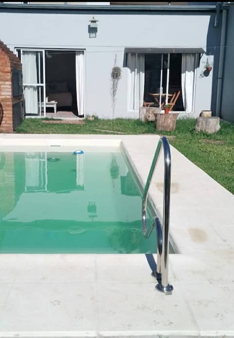 Accommodation with a pool, grill, and garage.