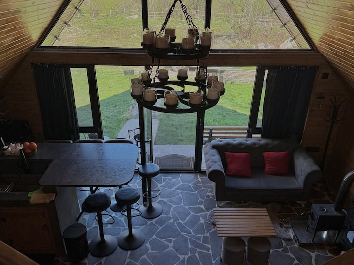 Bright interior with big panoramic windows offering a peaceful front view and plenty of natural light. Dedicated working space — perfect for both relaxation and remote work.