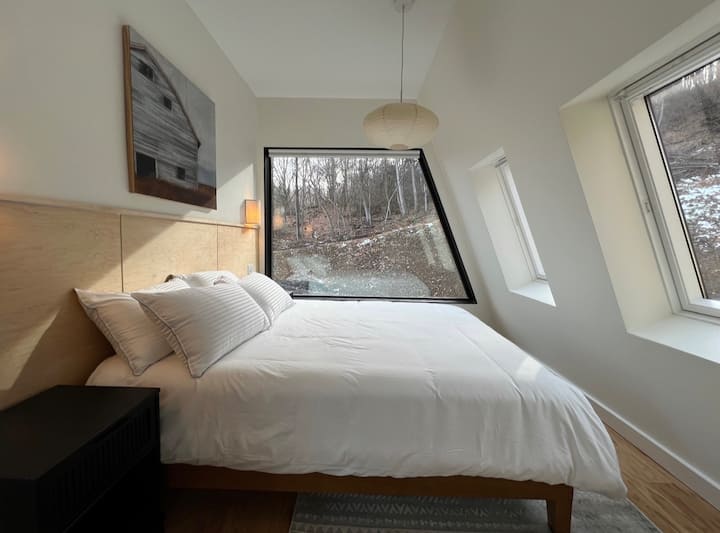 The next door down the corridor, you'll find your second bedroom. Featuring a queen bed