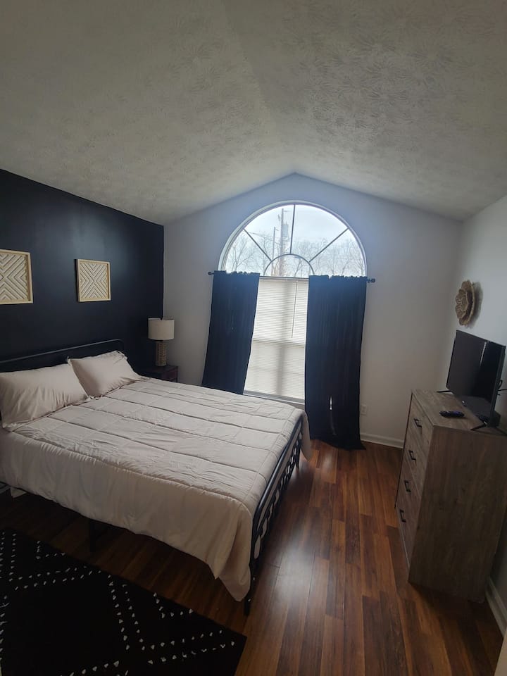 Queen bed with attached bathroom. 