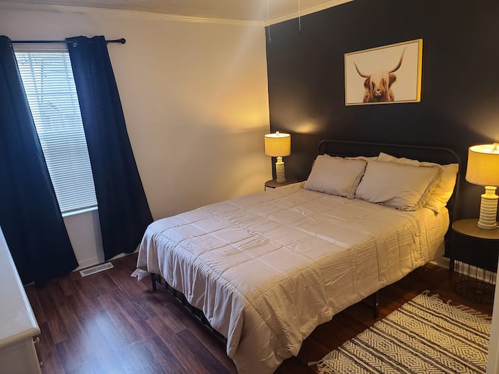 Queen bed with attached bathroom. 