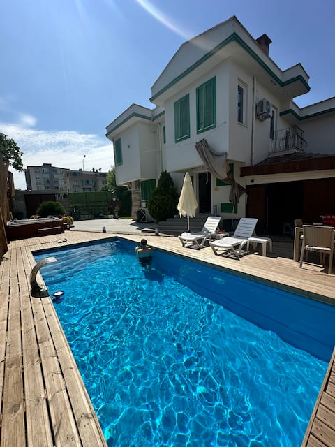 Villa with Green Shutters and Garden