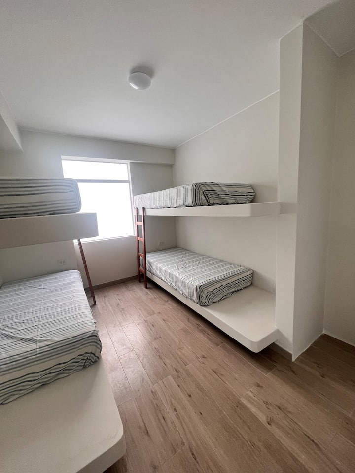 Room Room 3- 2 cabins with bookshelf and hangers.