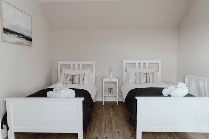 Our deepest Navy sea inspired twin room 