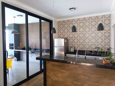 house with barbecue area and swimming pool