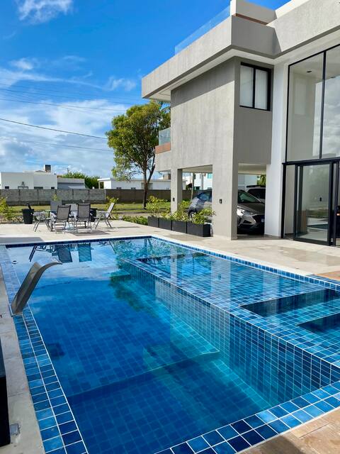 House with swimming pool condominium on the sand green dream