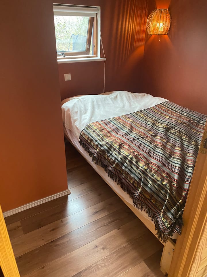 Bedroom is small. Double bed with a good mattress. Bed size 140cm x 200cm. Bed only accessible from one side. 