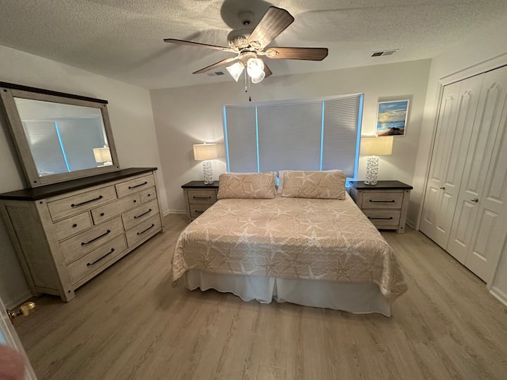 This bedroom is on the second floor.   It has a private bathroom with the shower seat.    The TV is a Roku with YouTube TV access for live sports, shows, and news.