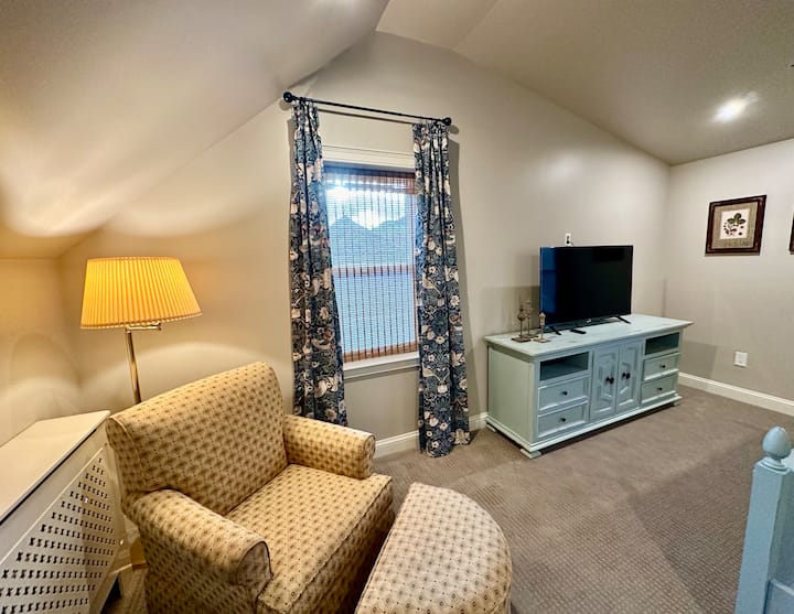 Vaulted ceilings make this upstairs king room feel extra spacious.  Windows on three walls insure great natural light and feature a gabled reading nook with a view towards the mountains.