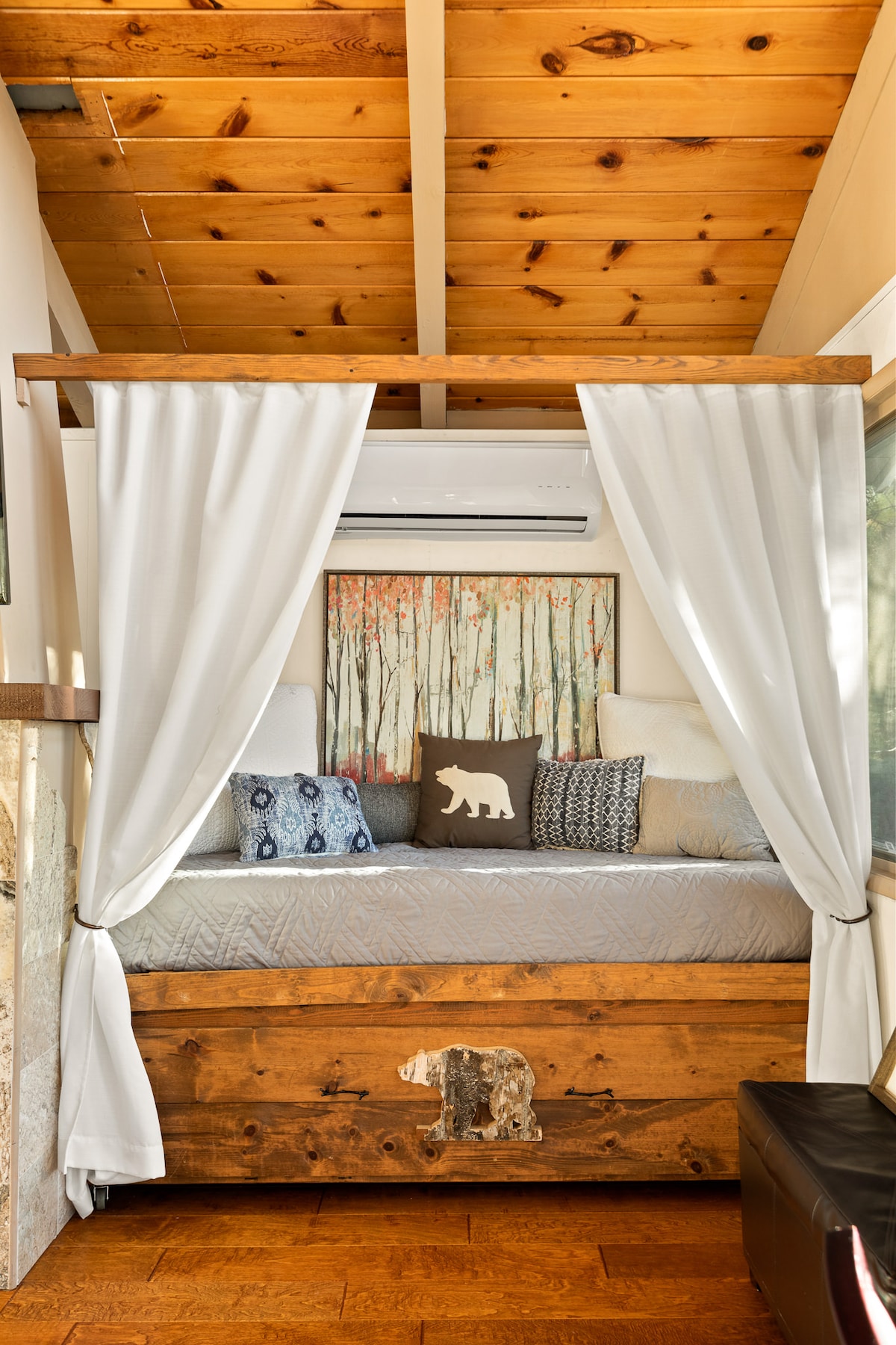 There are 2 twins here. Where the wooden bead below the top bed is you will find another twin bed that can be pulled out so they can be side by side, one high, one low.