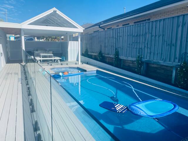 Sun-drenched brand new family home with pool gallery image 5