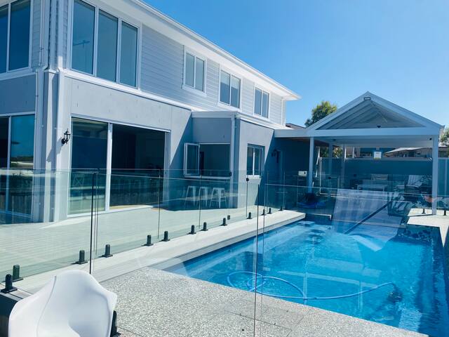 Sun-drenched brand new family home with pool gallery image 2
